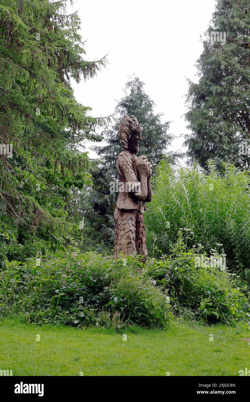 Carved wooden giant man nature figure at Forest Farm country park, Cardiff, South Wales. Summer July 2024 Stock Photo