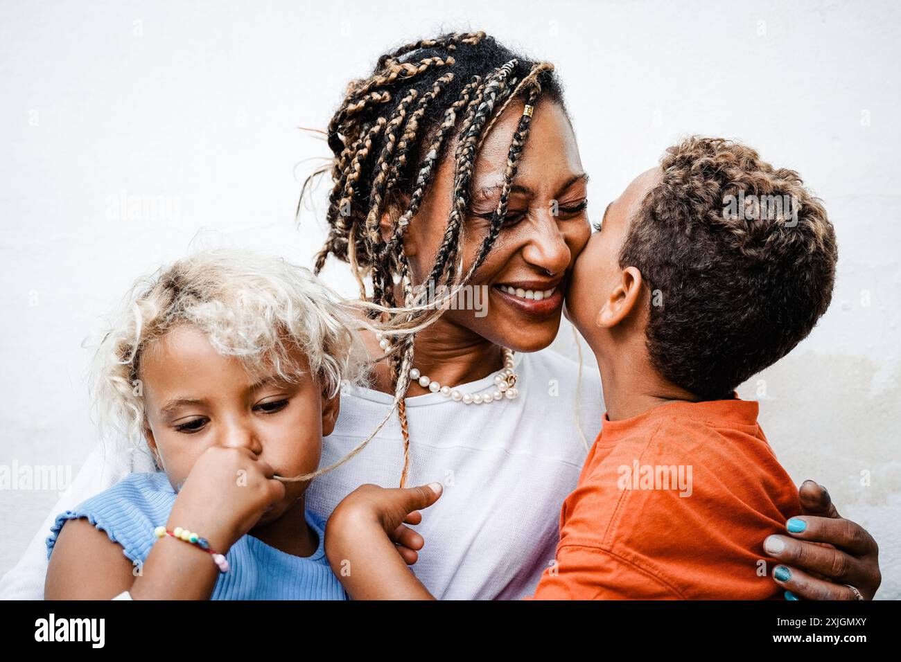 Family, Black mother, son and daughter having tender moment hugging