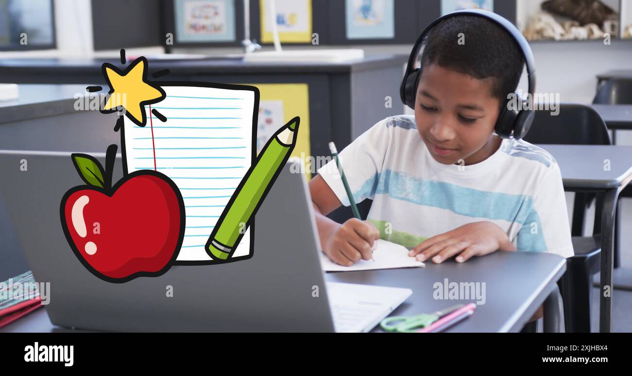 Studying at desk, child wearing headphones with school supplies image over scene Stock Photo