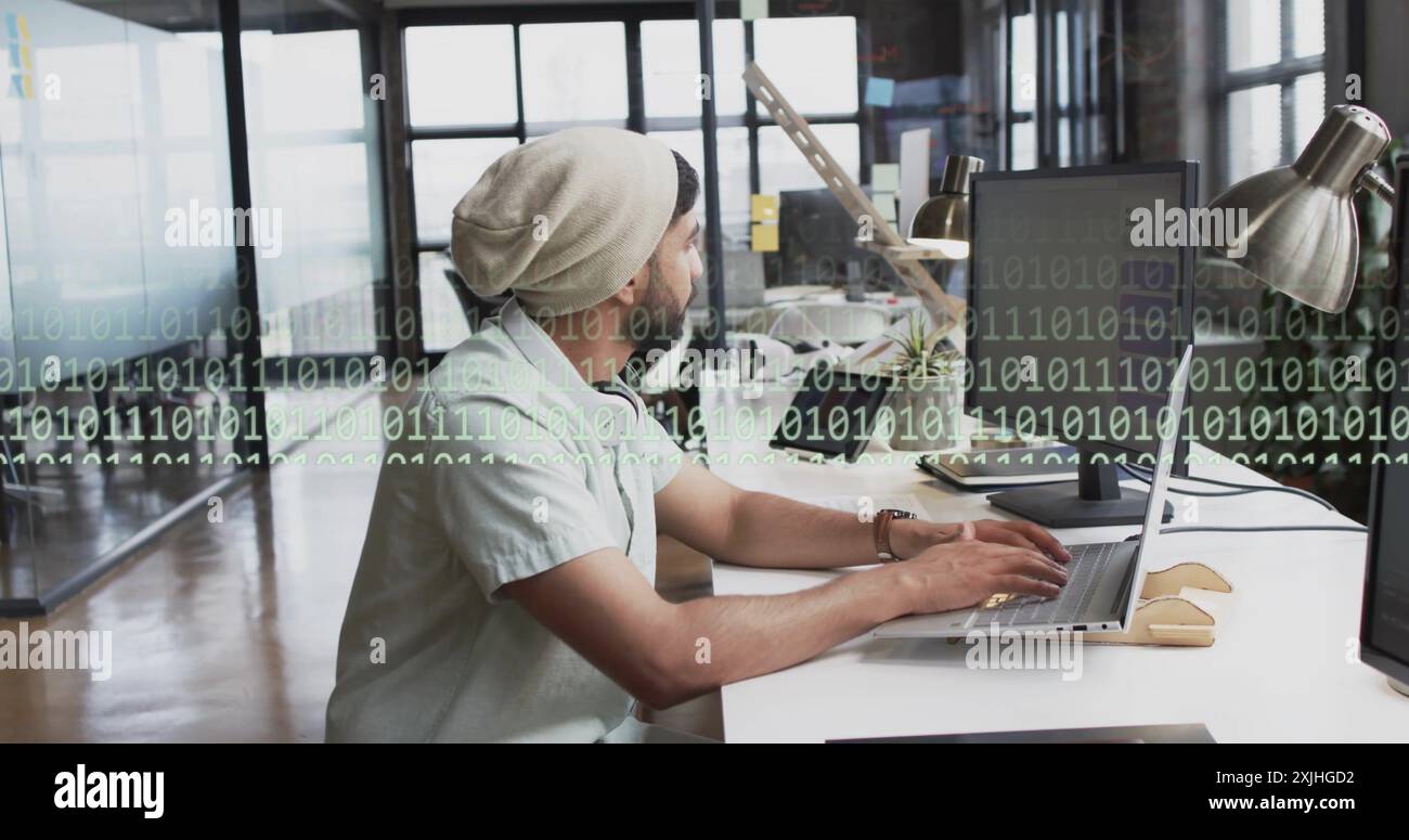 Image of binary coding and data processing over biracial businessman in office. Global finance, business, connections, computing and data processing c Stock Photo