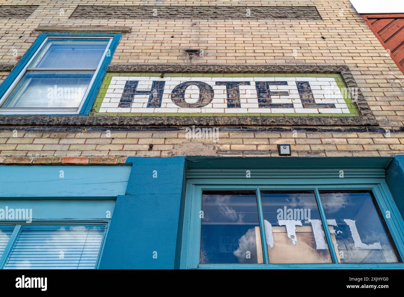 Faded lettering on the facade of an old hotel Stock Photo - Alamy