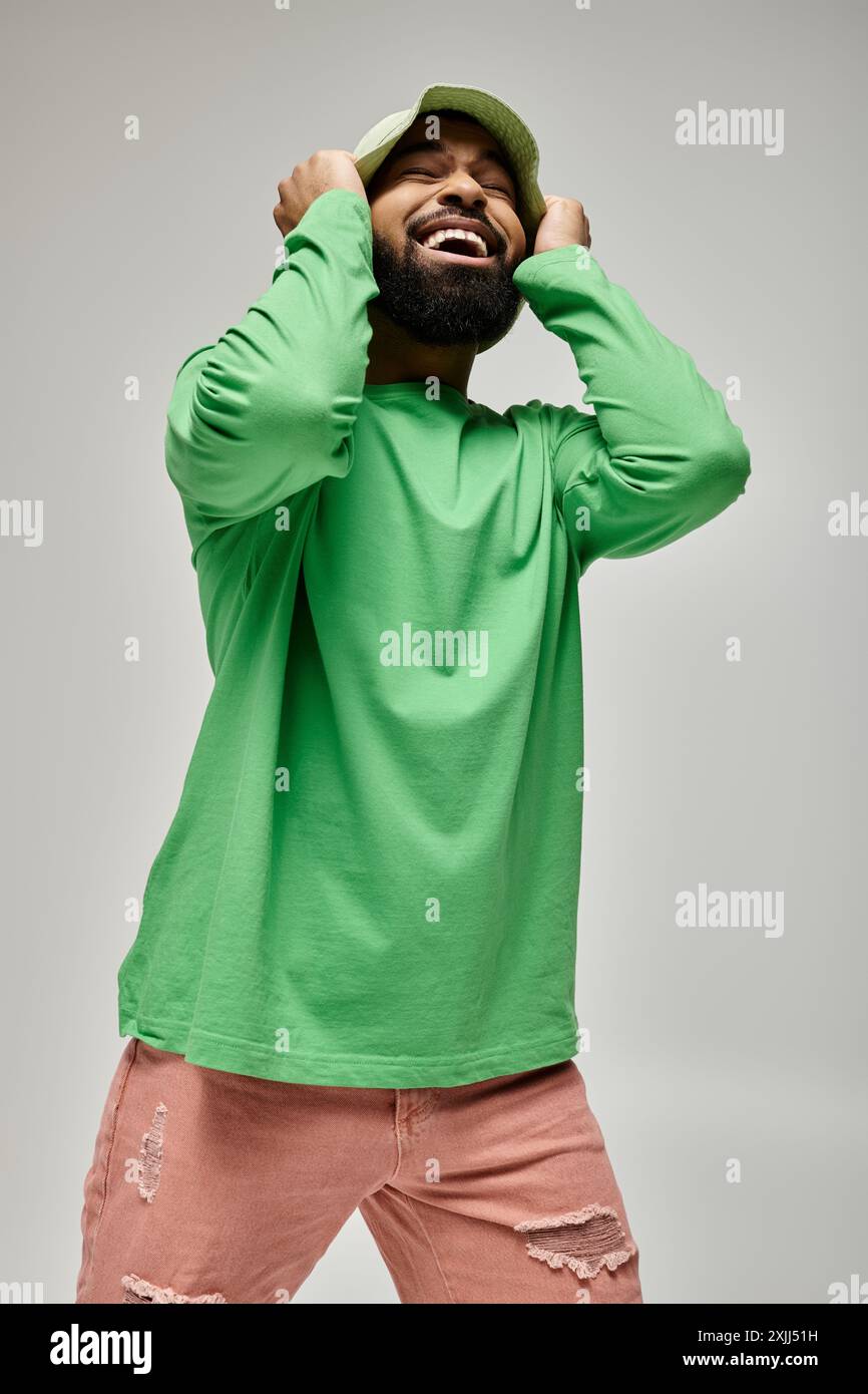 Stylish African American man strikes a pose in vibrant outfit Stock ...