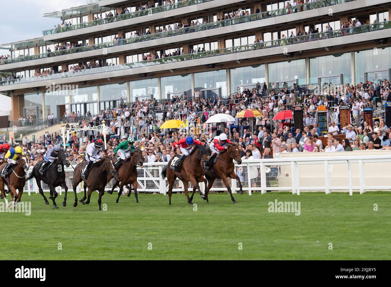 Ascot, Berkshire, UK. 13th July, 2024. Horse Surveyor (No 13) ridden by jockey Callum Shepherd wins the Village Hotels Fillies' Handicap Stakes at Ascot Racecourse in Berkshire at the Summer Mile Family Raceday. Owner Cheveley Park Stud, Trainer James Fanshawe, Newmarket, Breeder and Sponsor Cheveley Park Stud Limited. Credit: Maureen McLean/Alamy Live News Stock Photo