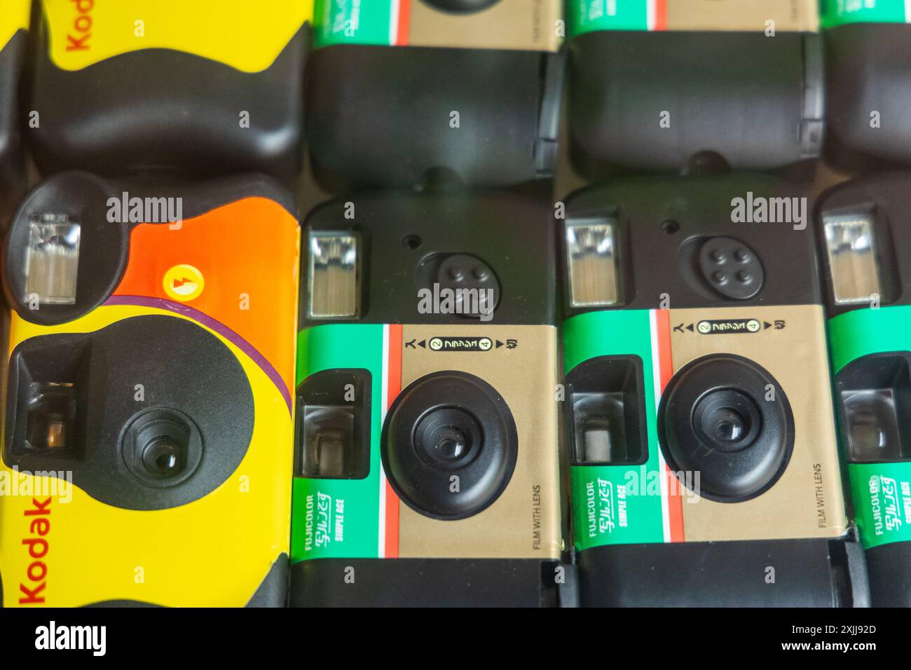 Yellow and green Kodak fuji film cameras on display in the shop. Analogue film camera. Point and shoot camera. Thailand Phuket July 18,2024 Stock Photo