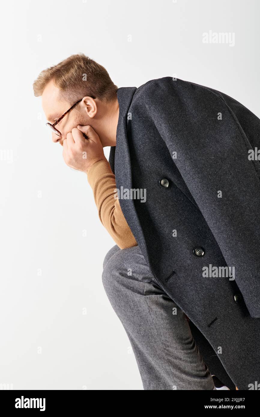 Man in suit leans hi-res stock photography and images - Alamy