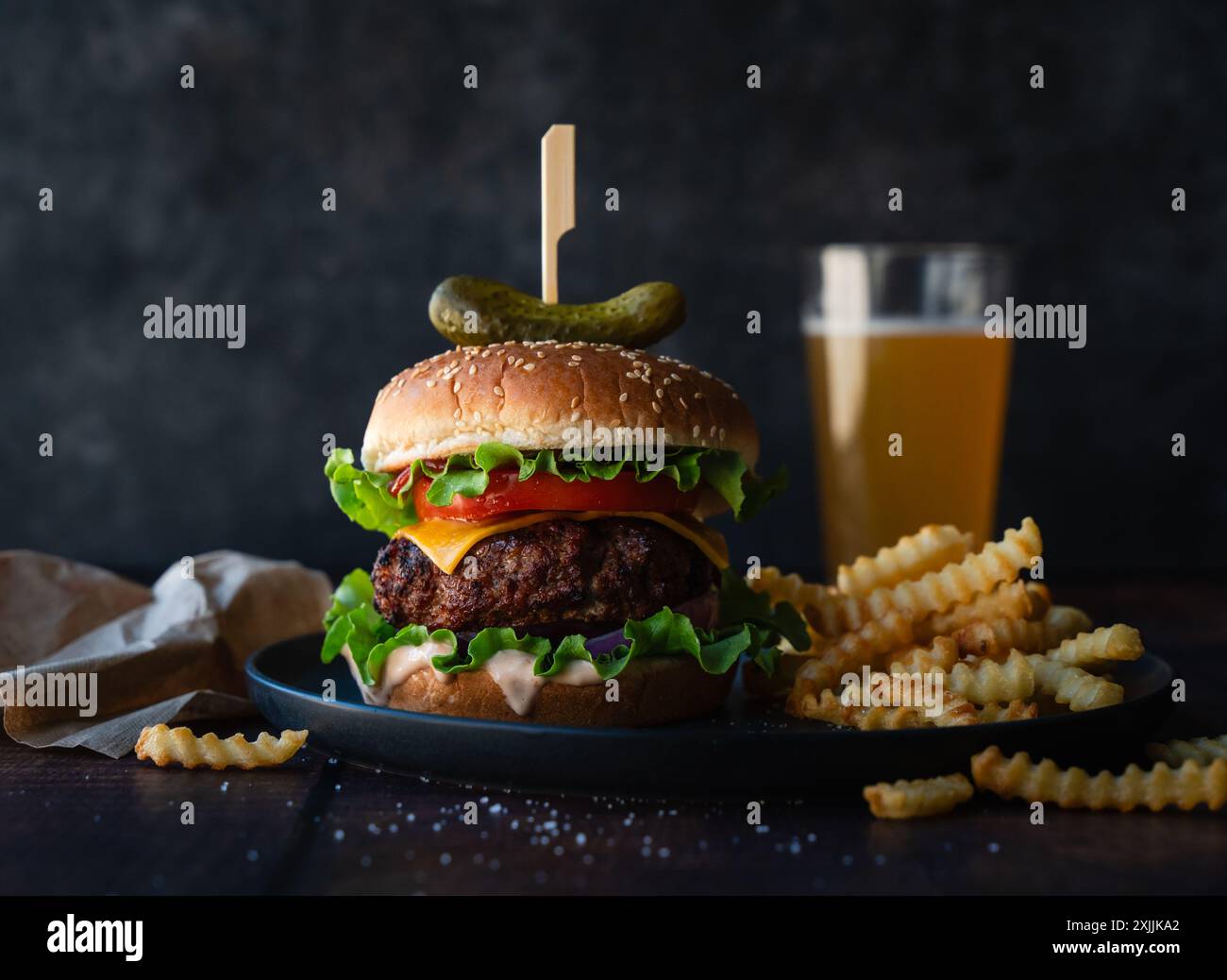 Bière avec Burger et frites avec givré jante sur une tableau. génératif ai  26190957 Photo de stock chez Vecteezy, image size:1300x1038