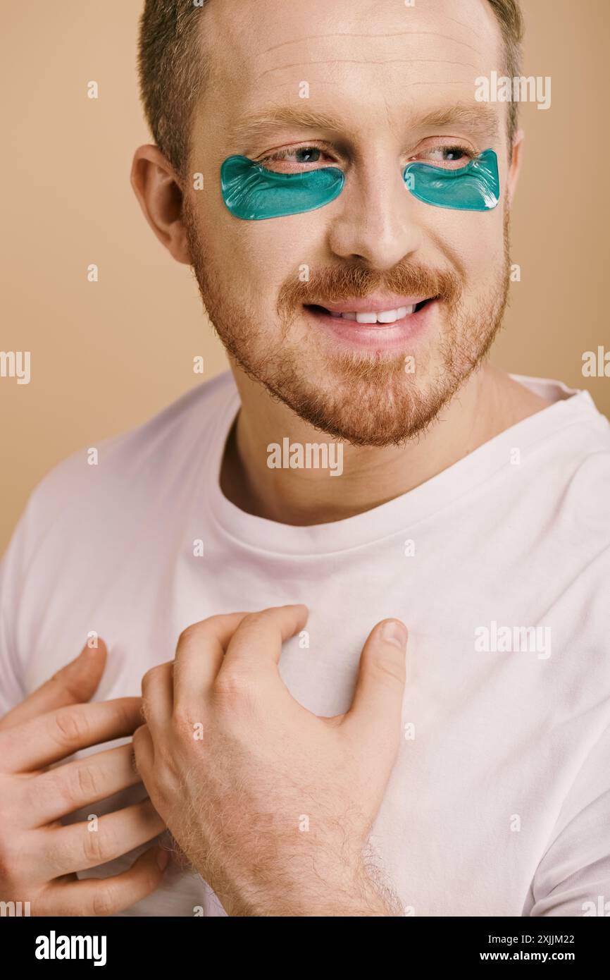 A handsome man in casual attire wearing striking blue eye patches Stock ...