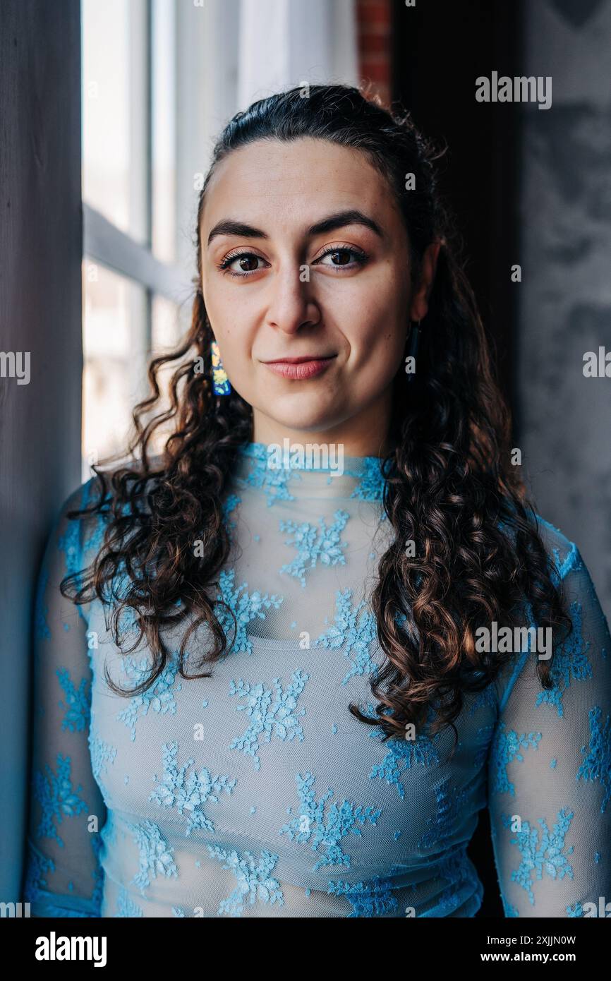 Woman in blue top hi-res stock photography and images - Alamy