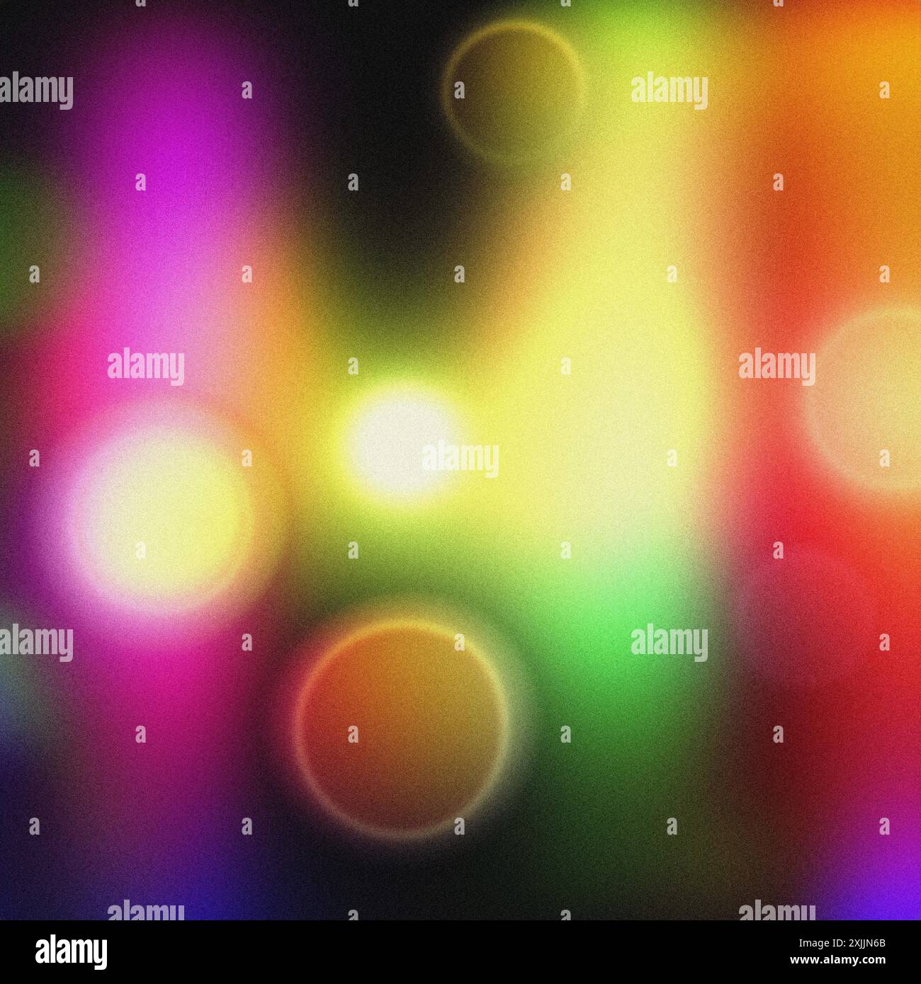 Festive atmosphere created by blurry lights against a colorful grainy background Stock Photo
