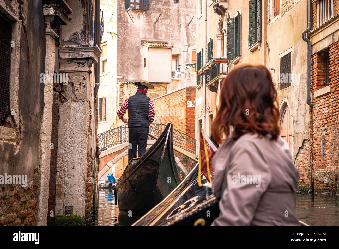 Tourist admiring Venice on a gondola tour Stock Photo - Alamy