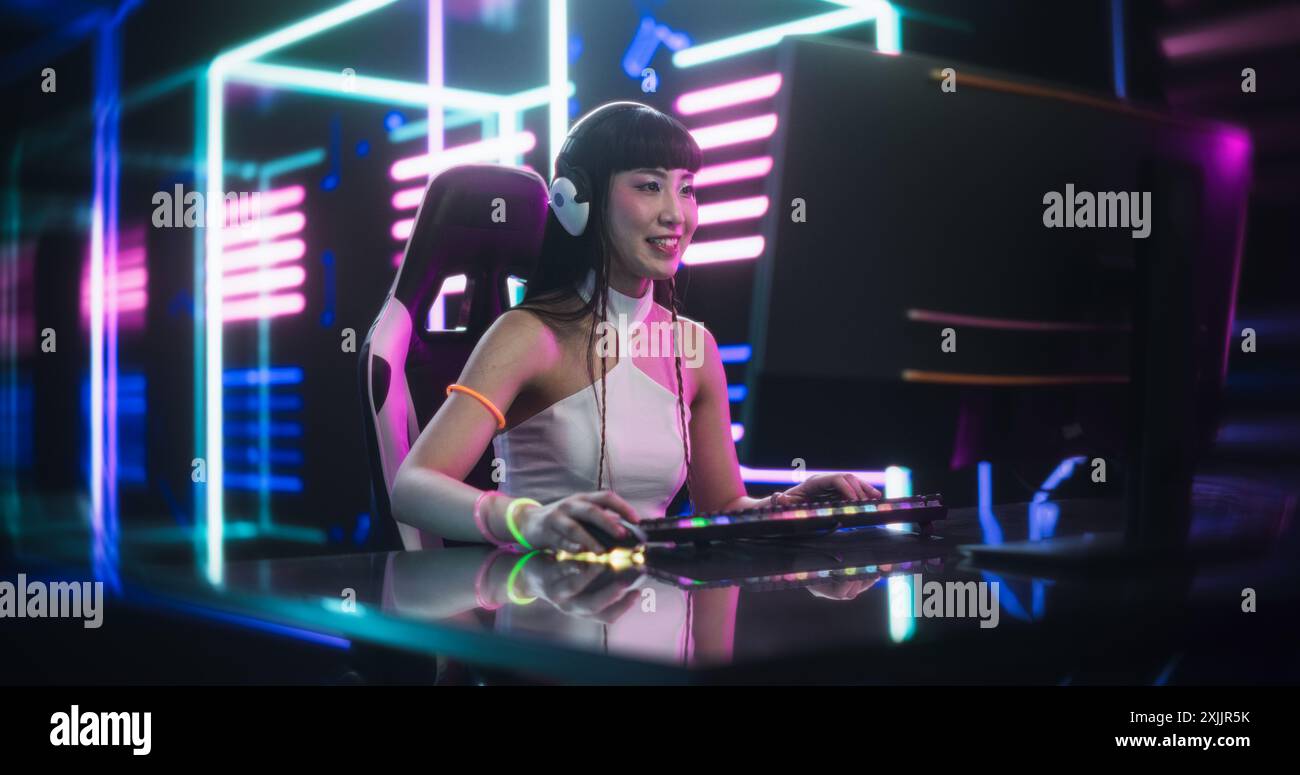 Young Female Gamer Playing Online Video Game on a Computer in a ...