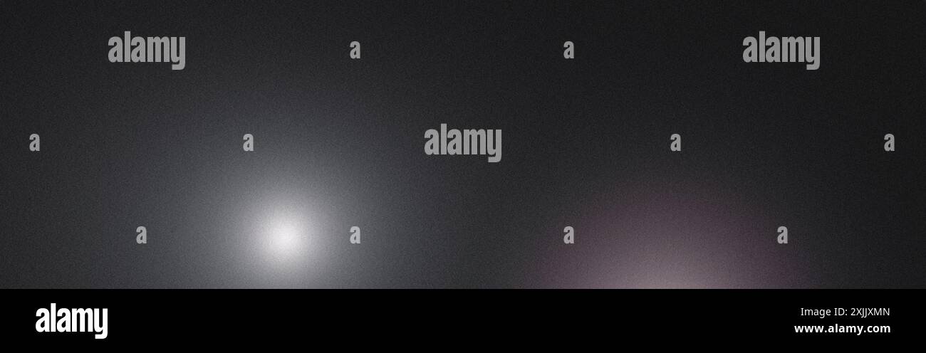 Abstract background featuring a grainy texture with two light spots creating a gradient Stock Photo