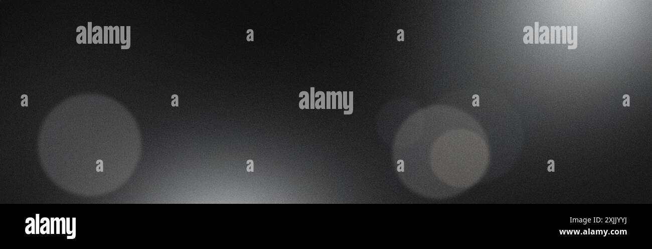 Grainy black and white background with blurred lights effect Stock Photo