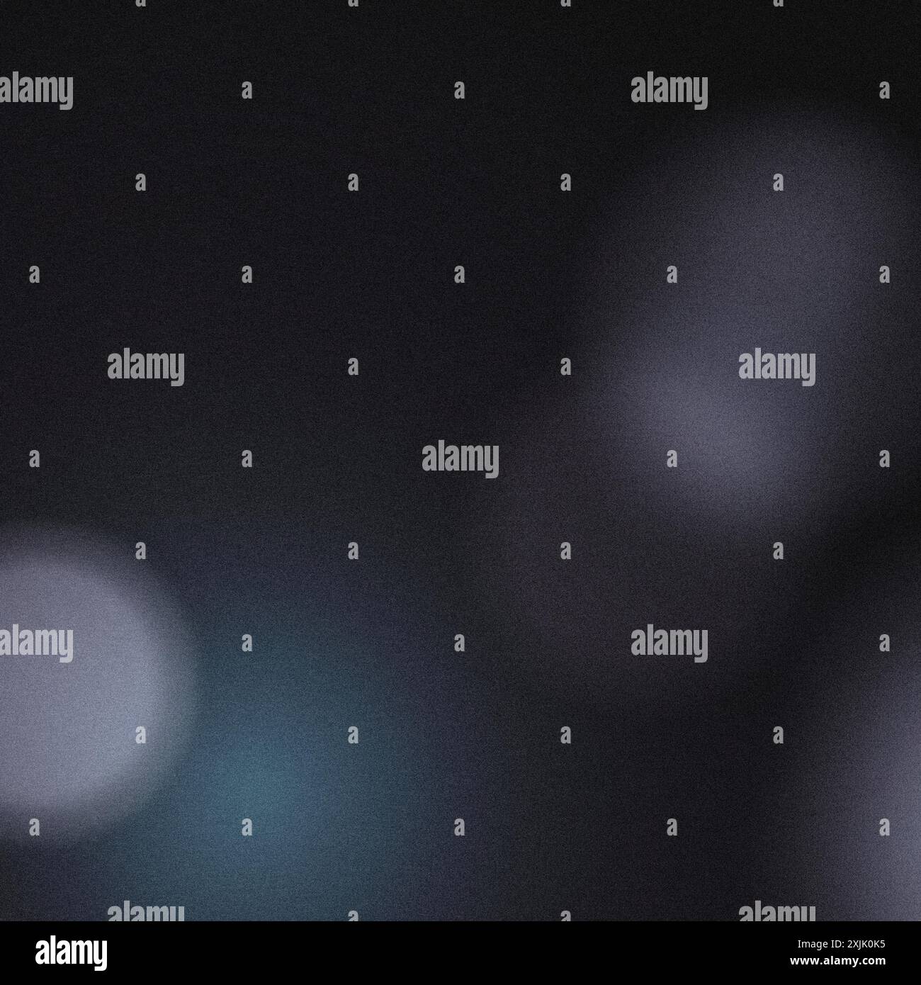 Abstract background featuring defocused blurred lights creating a grainy texture Stock Photo
