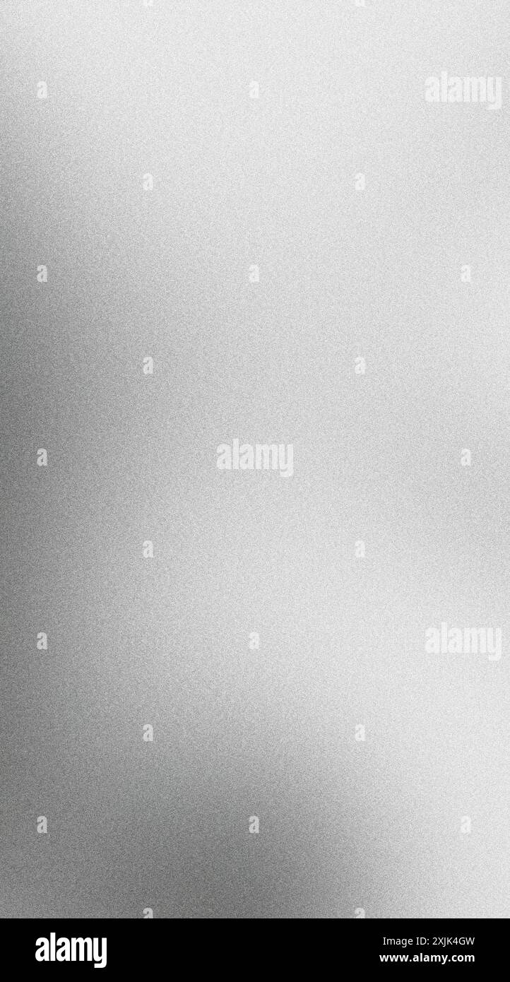 Light reflecting off a brushed metal surface creating a subtle grainy texture Stock Photo