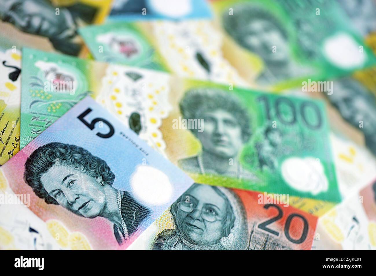 KYIV, UKRAINE - JULY 10, 2024 Australian Dollar bills on table close up, Aussie currency money banknotes Stock Photo