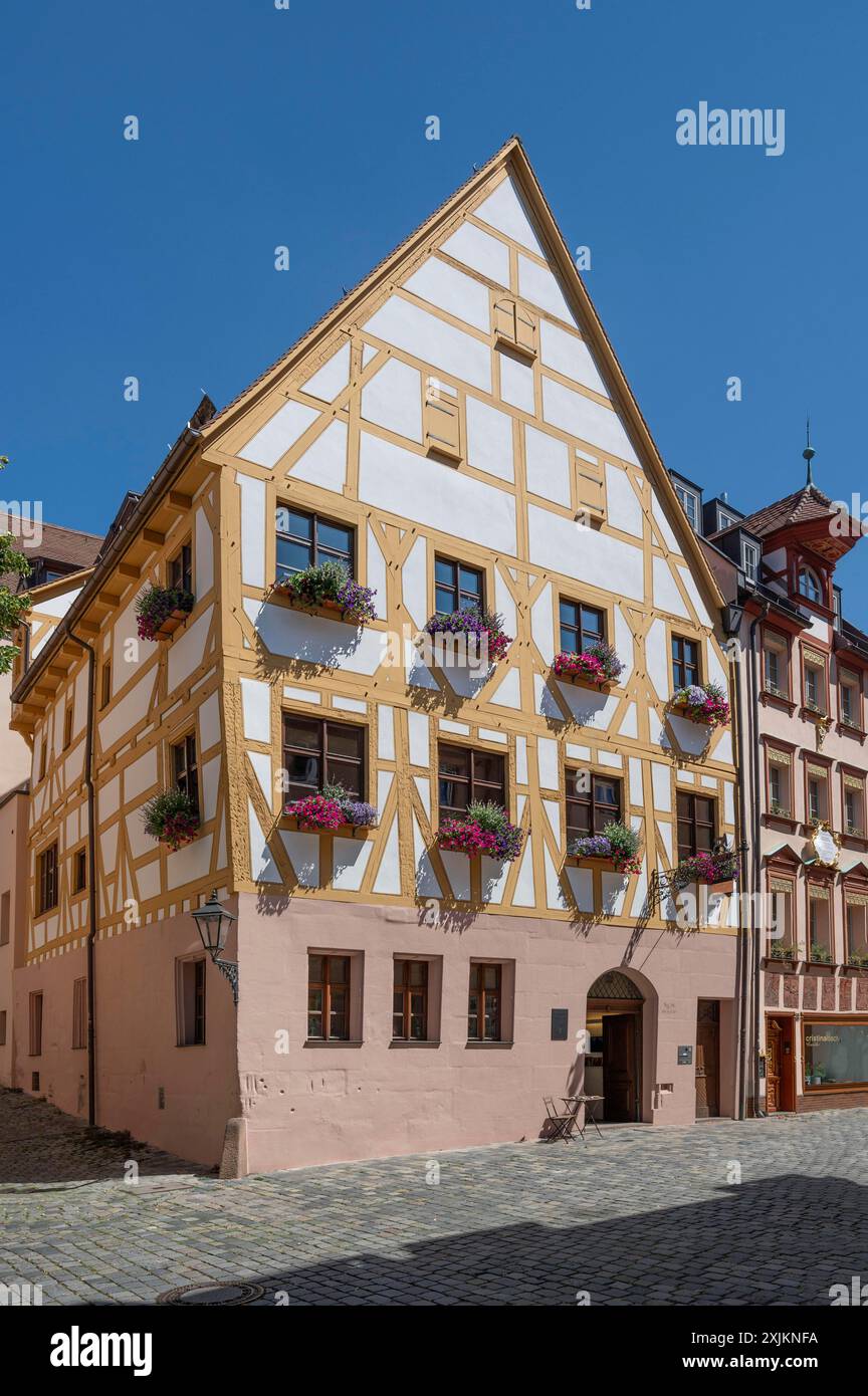 Historic halftimbered house, headquarters of Alstadtfreunde Nuernberg, blue sky