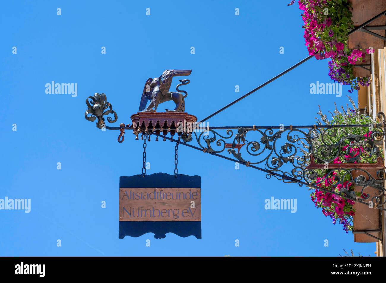 Griffin as a cantilever on the house of the Alstadtfreunde Nuremberg, blue sky, Weissgebergasse, Nuremberg, Middle Franconia, Bavaria, Germany Stock Photo