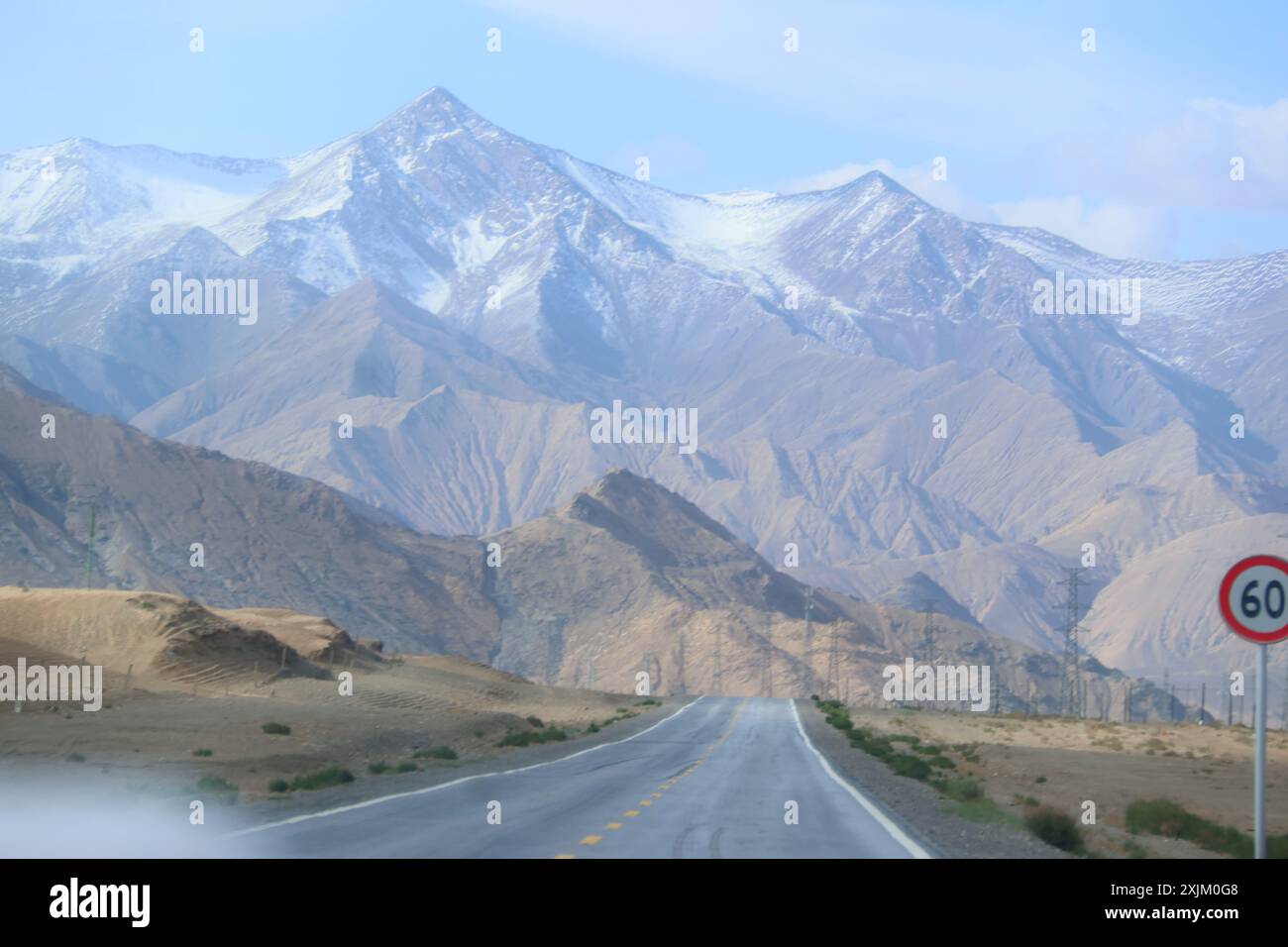 'Traversing the Majestic Kunlun Mountains: A Journey Through the Heart of Kekexili on an Epic Highway Adventure' Stock Photo