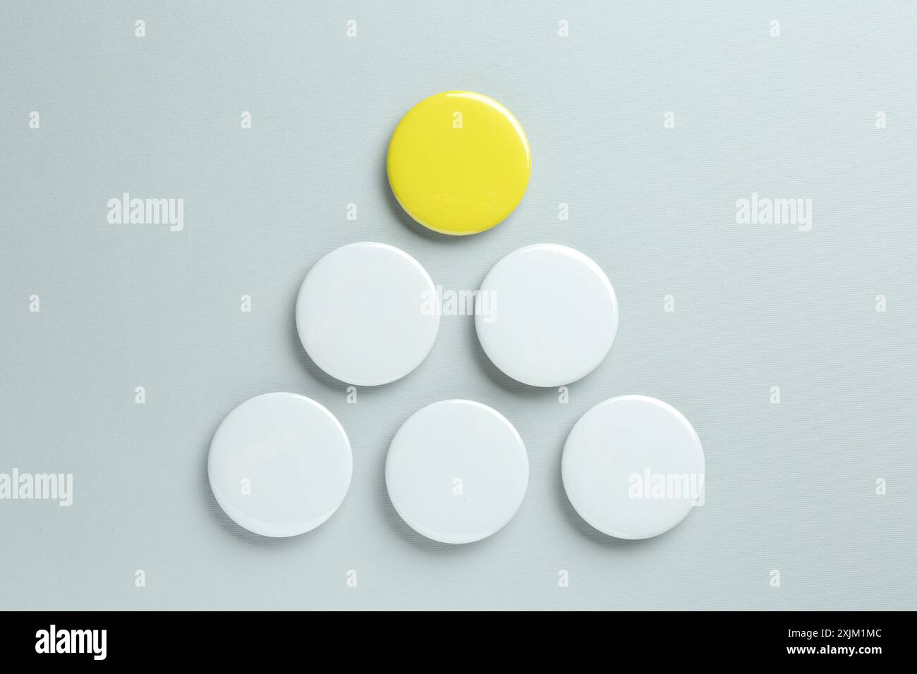 Blank button badges on light background, flat lay. Mockup for design Stock Photo