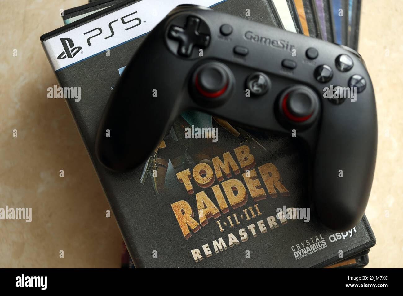KYIV, UKRAINE JUNE 26, 2024 Tomb Raider 123 Remastered PS5 video game disc box for console