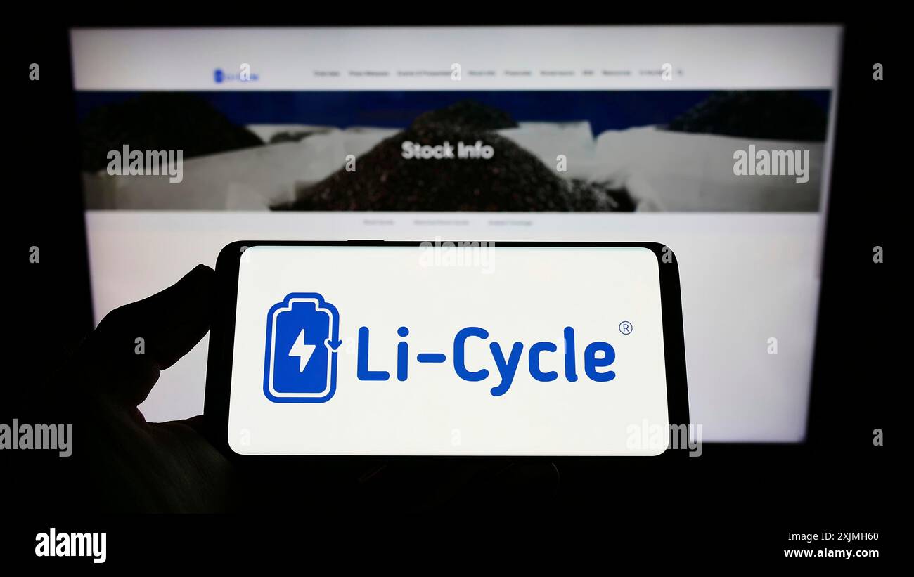 Stuttgart, Germany, 07-16-2022: Person holding smartphone with logo of battery recycling company Li-Cycle Corp. on screen in front of website. Focus Stock Photo