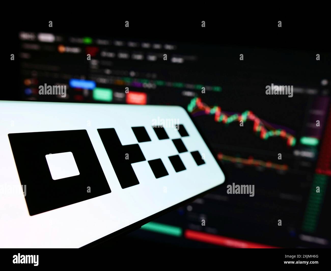Stuttgart, Germany, 07-17-2022: Smartphone with logo of crypto company Aux Cayes FinTech Co. Ltd. (OKX) on screen in front of website. Focus on Stock Photo