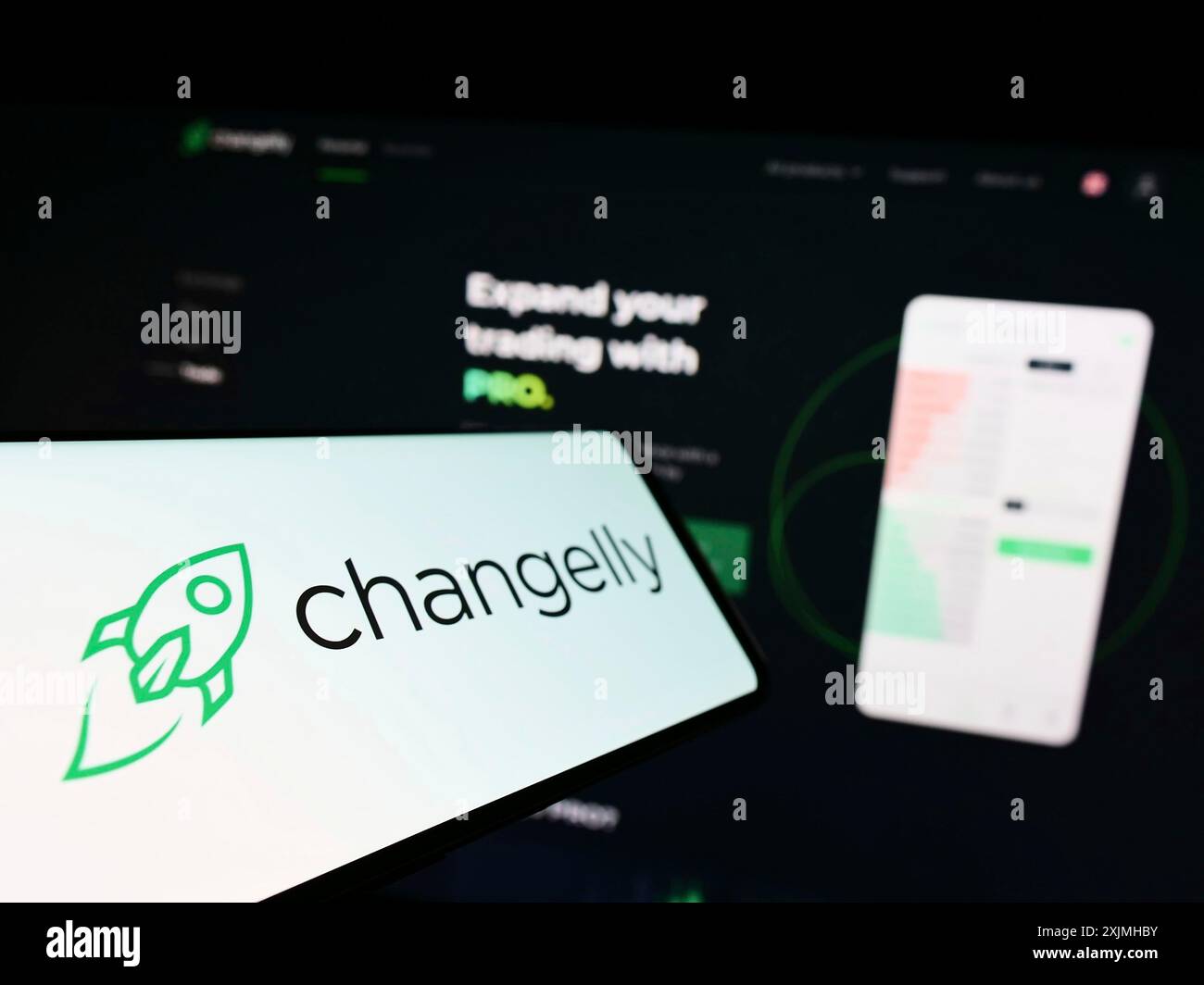 Cellphone with logo of crypto exchange Fintechvision Ltd. (Changelly) on  screen in front of business website. Focus on left of phone display Stock  Photo - Alamy