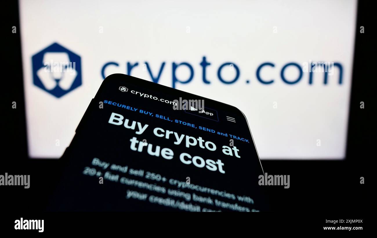 Mobile phone with webpage of crypto company Foris DAX MT Limited (Crypto.com)  on screen in front of logo. Focus on top-left of phone display Stock Photo  - Alamy