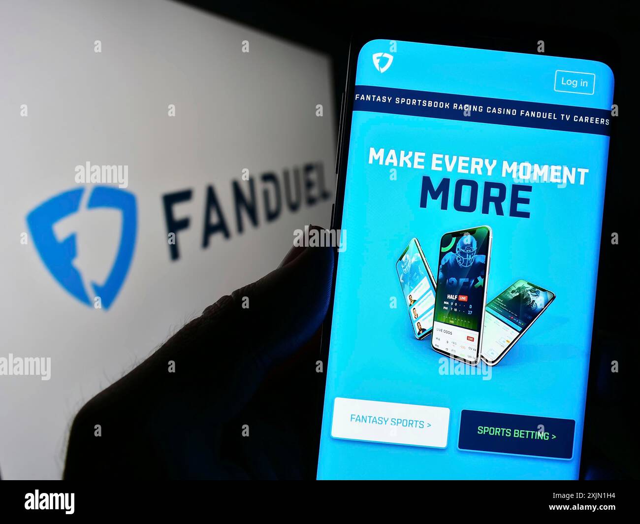 Stuttgart, Germany, 01-16-2023: Person holding cellphone with webpage of US gambling company FanDuel Inc. on screen in front of business logo. Focus Stock Photo