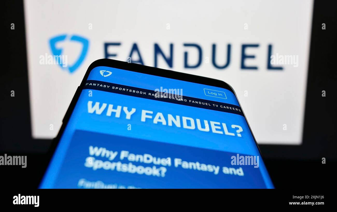 Stuttgart, Germany, 01-16-2023: Mobile phone with website of US gambling company FanDuel Inc. on screen in front of business logo. Focus on top-left Stock Photo