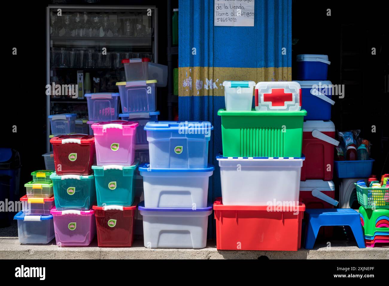 Colourful plastic containers outside of a shop, Panajachel, Guatemala, Central America Stock Photo