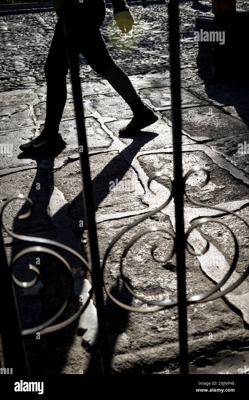 Person walking in the Spanish colonial-era city centre, Antigua, Guatemala, Central America Stock Photo