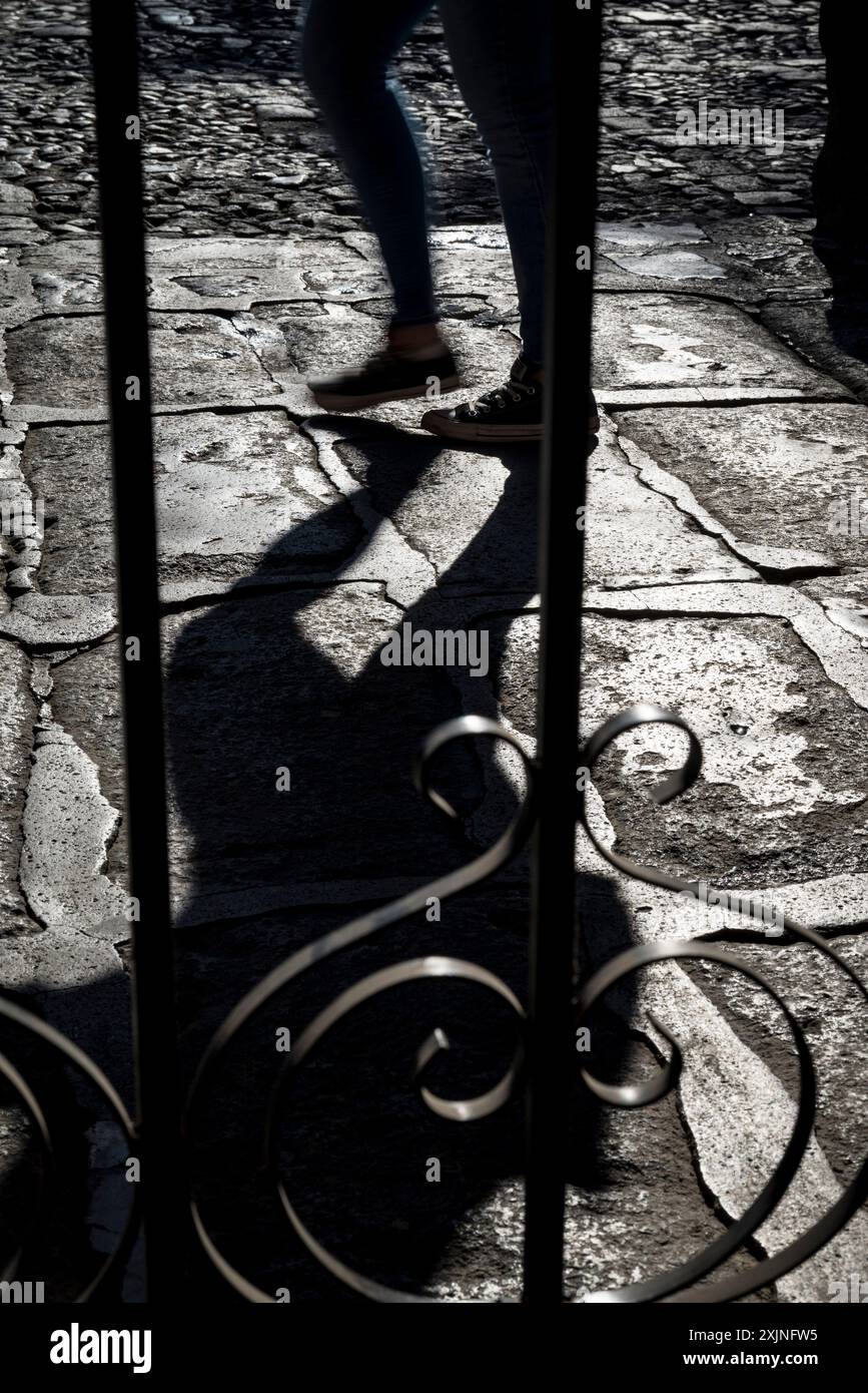 Person walking in the Spanish colonial-era city centre, Antigua, Guatemala, Central America Stock Photo