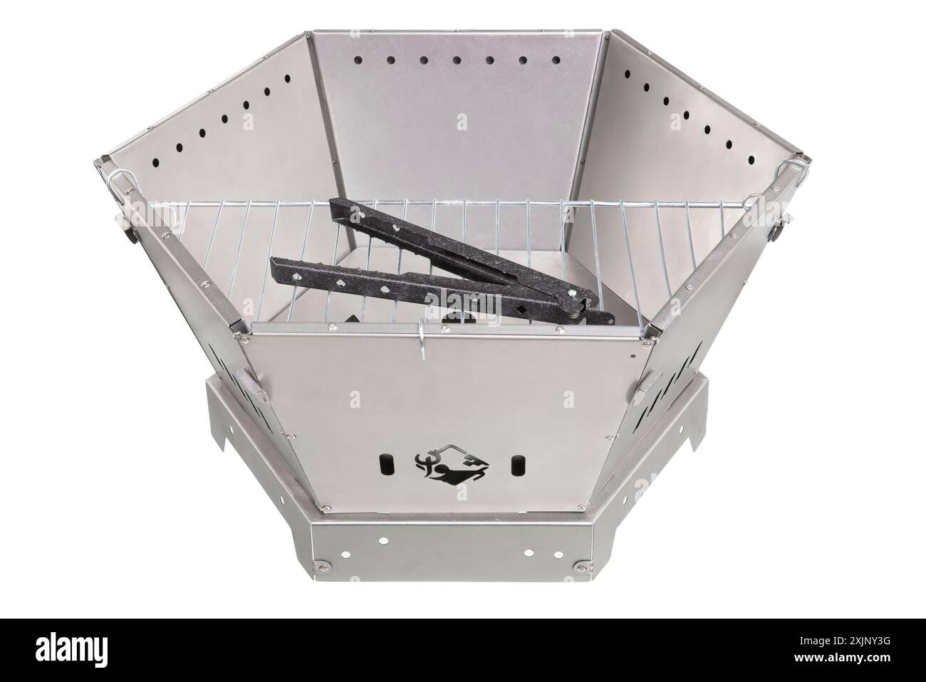 Hexagonal metal fire pit with grilling accessories. Stock Photo
