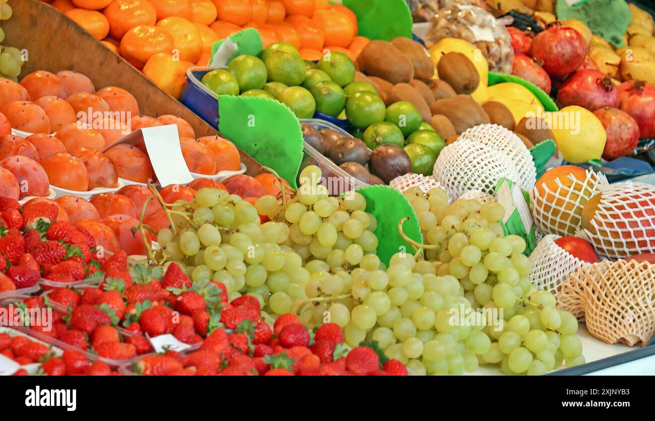 Colorful fruits pile outside on a market Stock Photo - Alamy