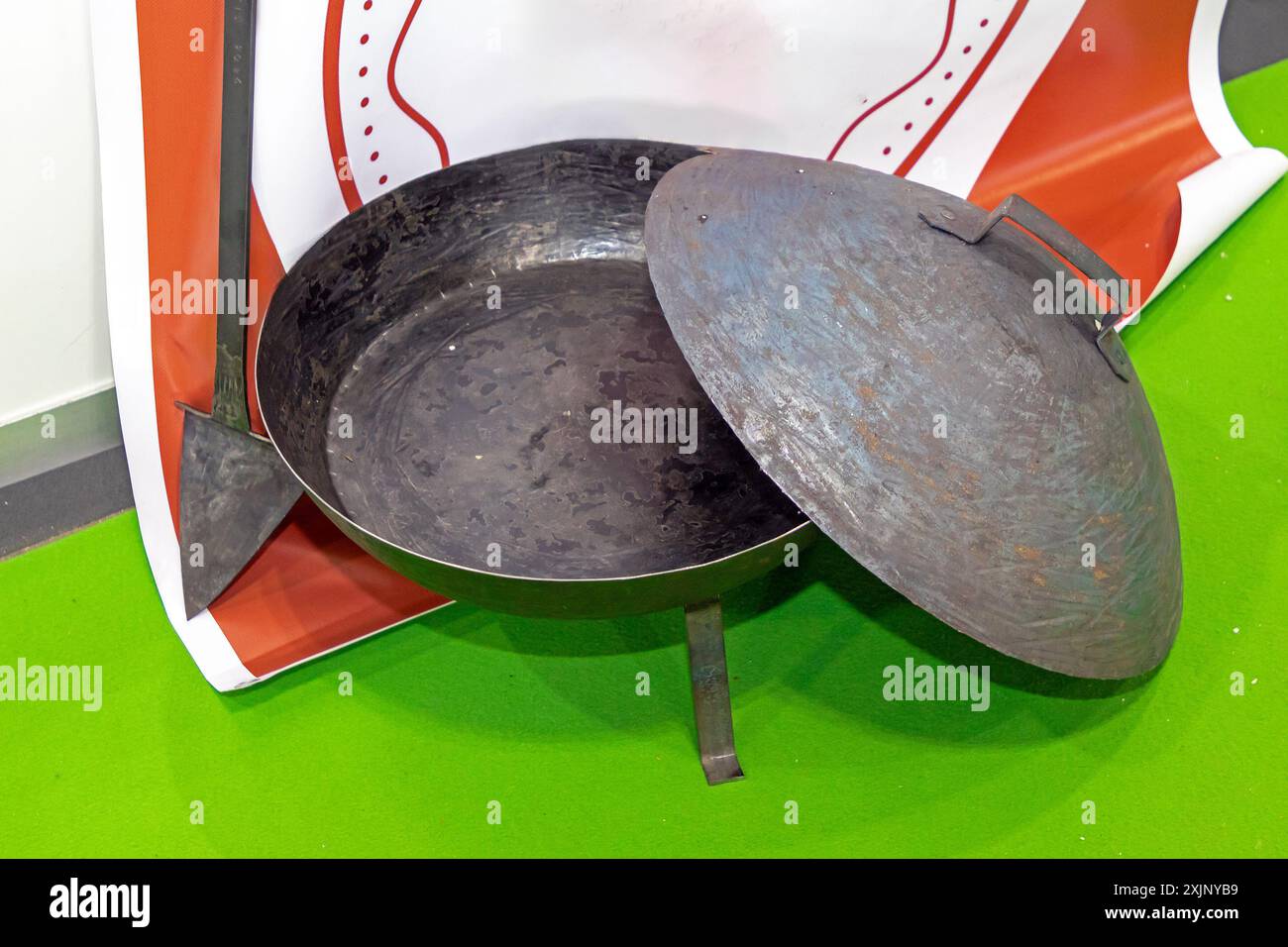 Open cast iron metal pot outside on market Stock Photo