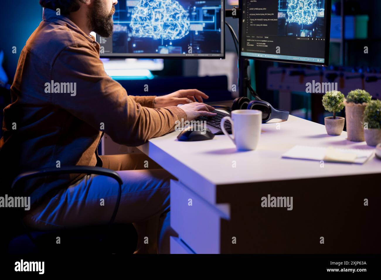 Freelancing computer engineer doing maintenance on artificial intelligence neural networks computerized model. Remote tech support specialist at working from home, doing checkup on AI systems Stock Photo