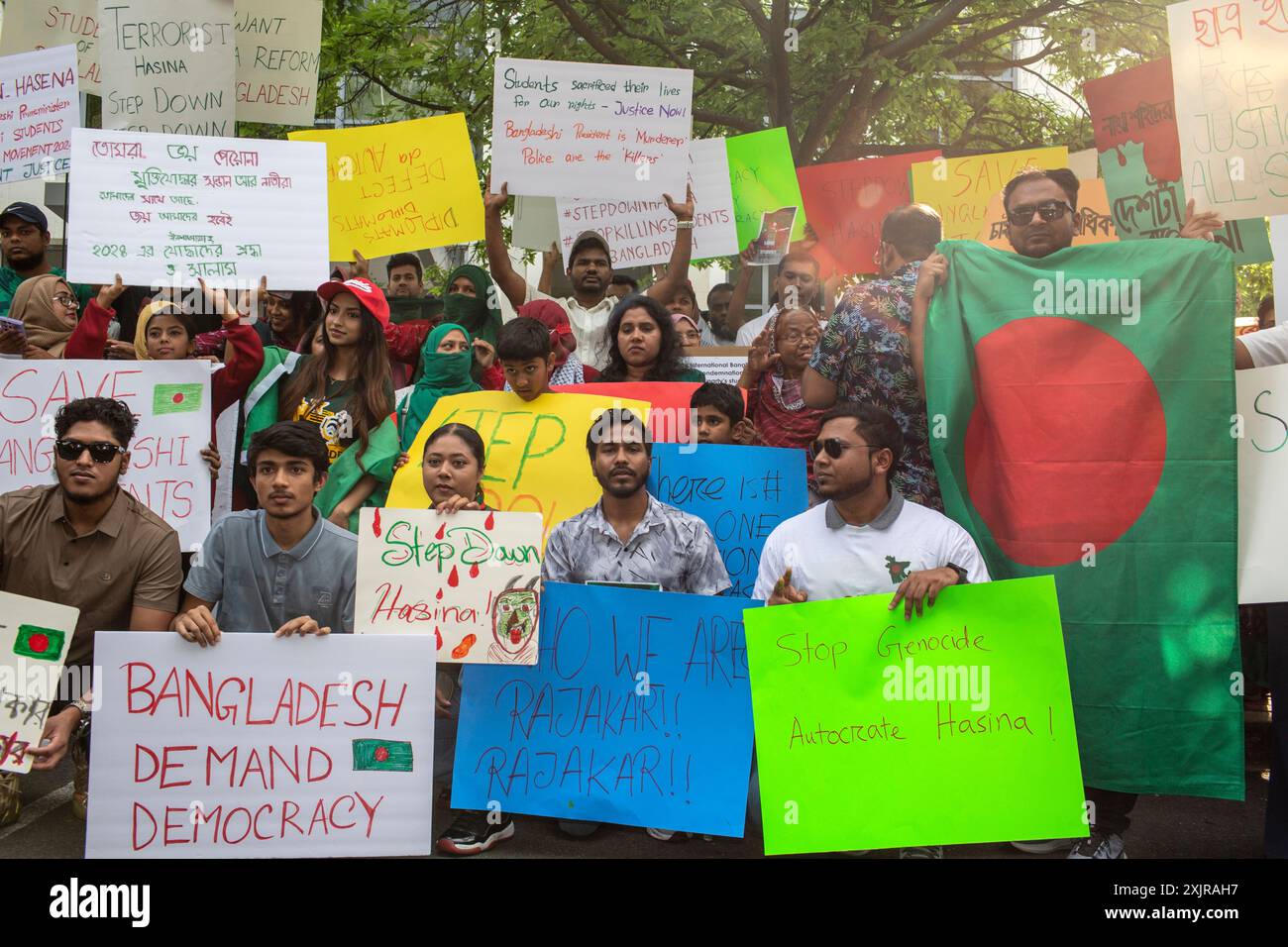 Washington, USA. 19th July, 2024. Bangladeshi people gather with 