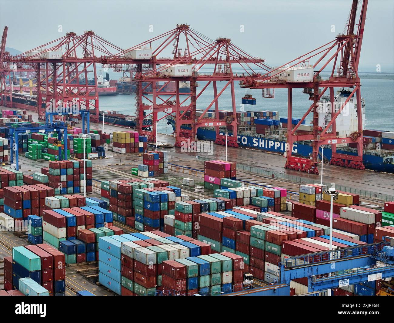 LIANYUNGANG, CHINA - JULY 20, 2024 - Cargo ships stop at their berths ... image.