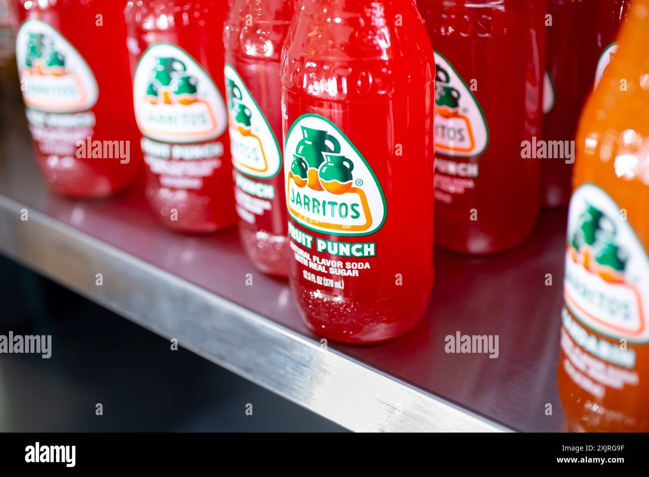 Los Angeles, California, United States - 03-18-2021: A view of several bottles of Jarritos fruit punch soda bottles, at the store. Stock Photo