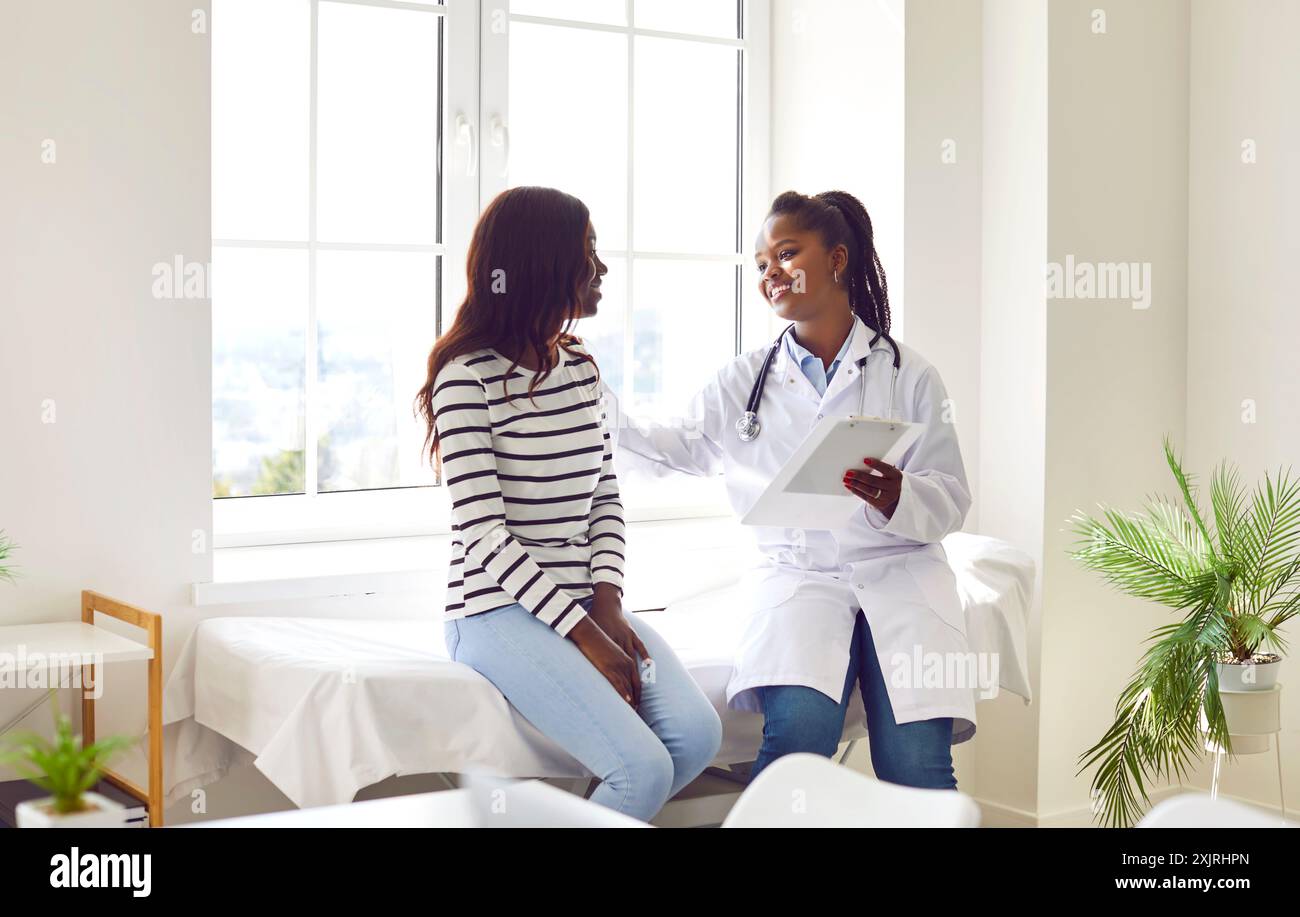 Female doctor consulting black african hi-res stock photography and ...