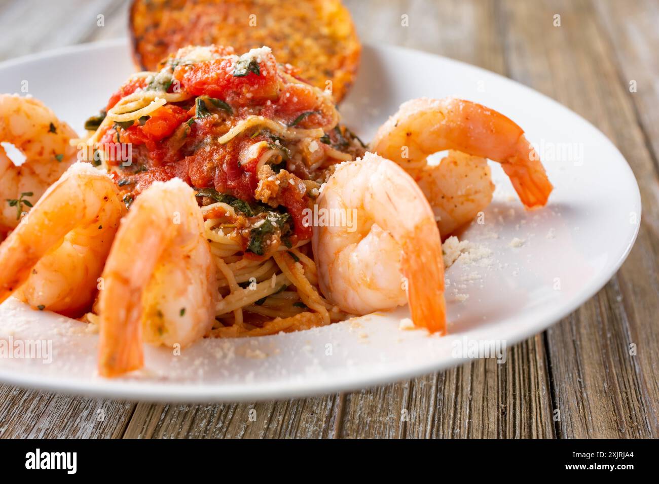 A view of a plate of angel hair pasta with shrimp. Stock Photo