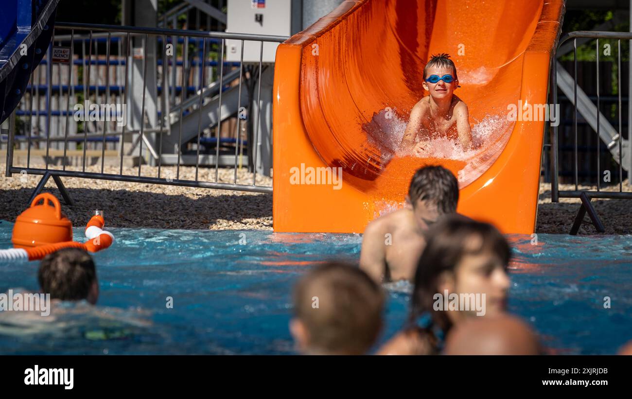 People enjoy hot sunny day at the Jindrich outdoor swimming pool in Havirov, Czech Republic, July 18, 2024. (CTK Photo/Petr Sznapka) Stock Photo