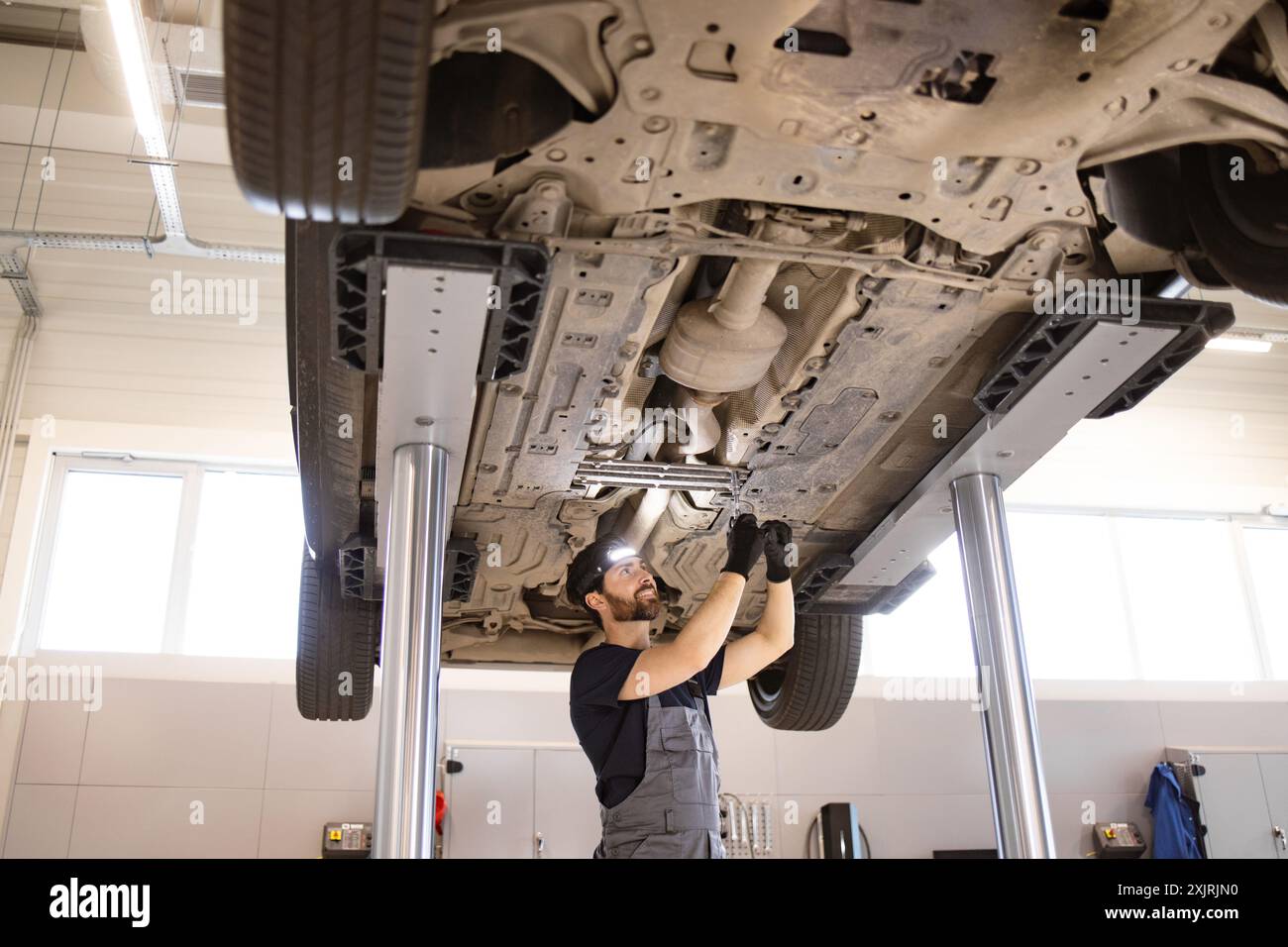 Auto raised car lift in hi-res stock photography and images - Alamy