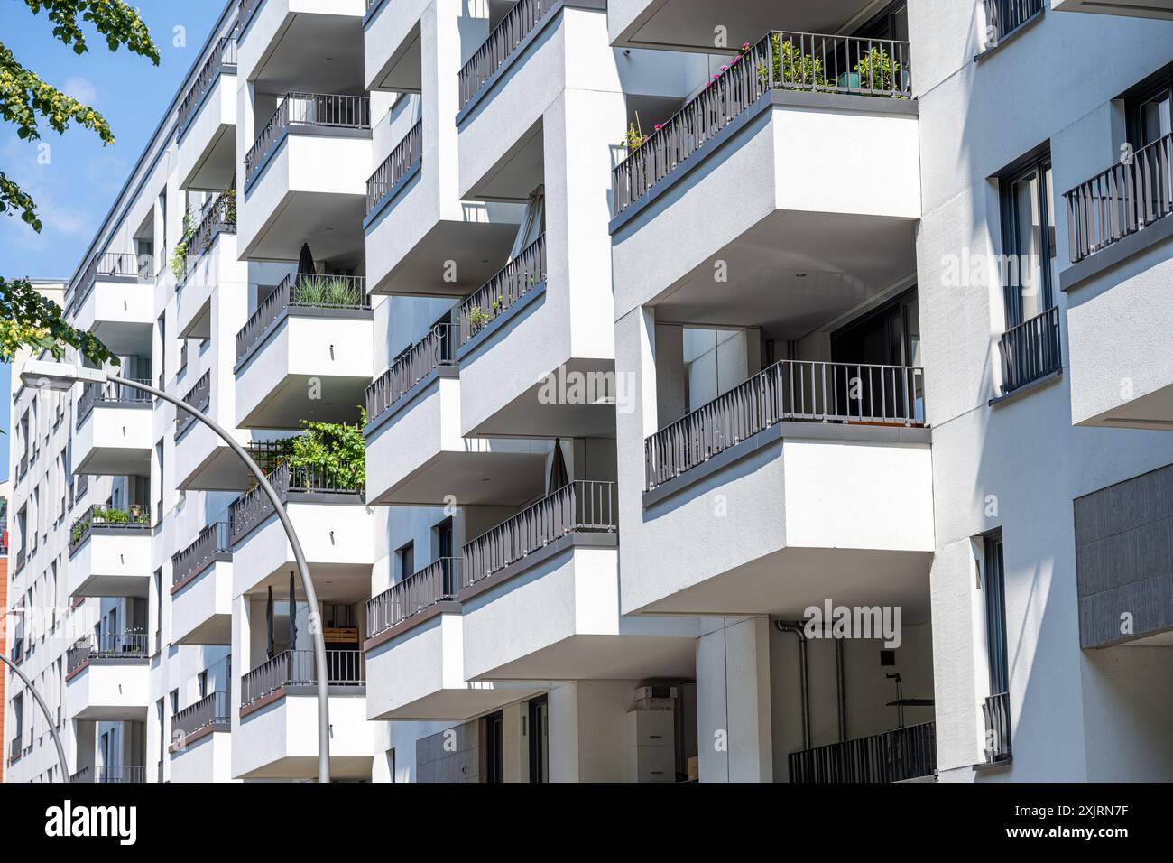 The facade of a white modern apartment building seen in Berlin, Germany ...