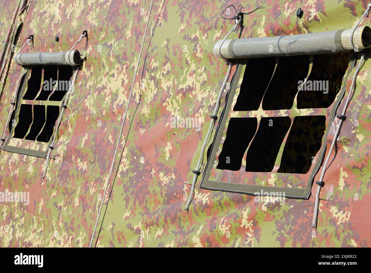 Detail of windows of a military tent with camouflage fabric to prevent ...