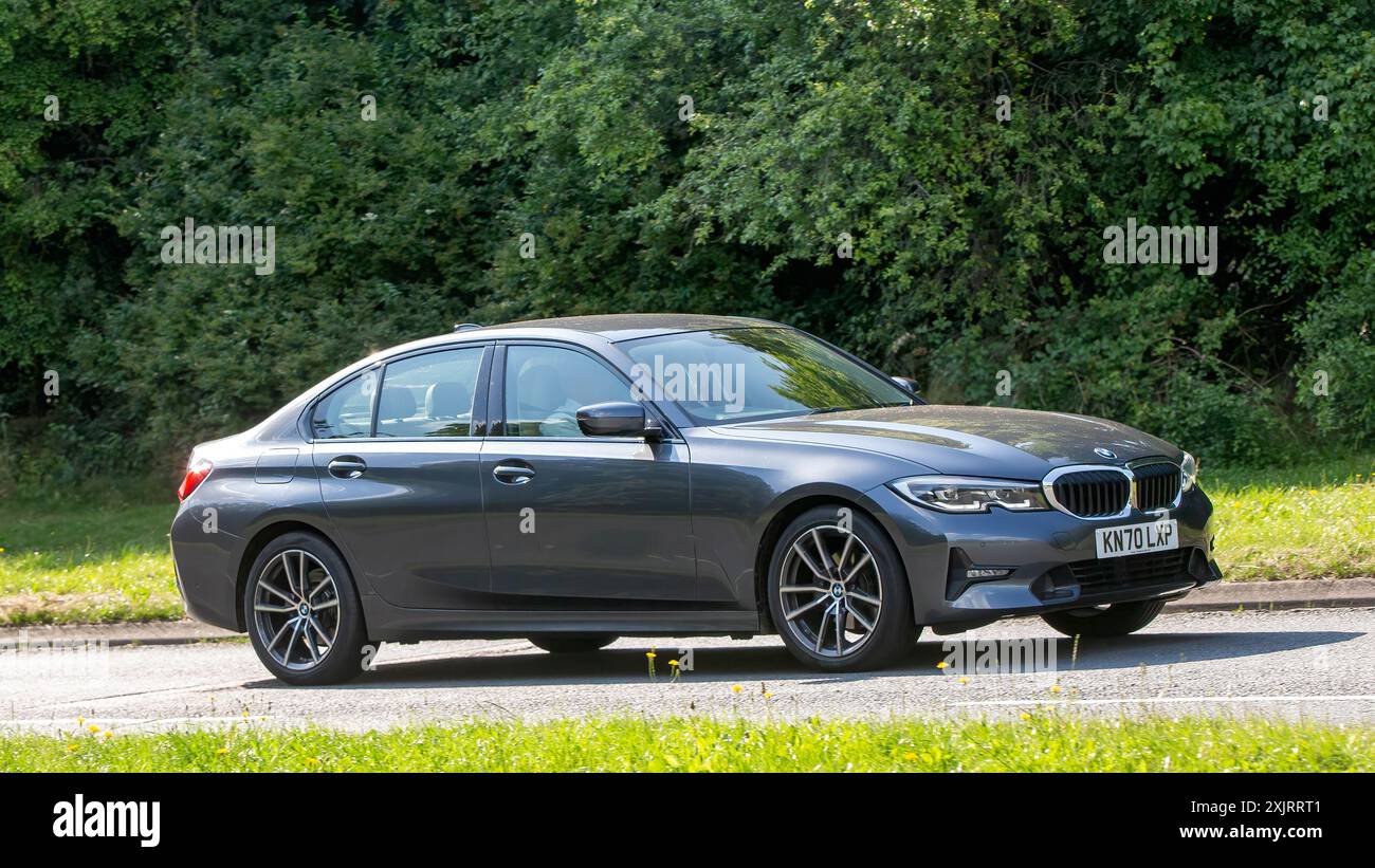 Milton Keynes,UK - July 18th 2024: 2020 grey BMW 320i sport car driving ...