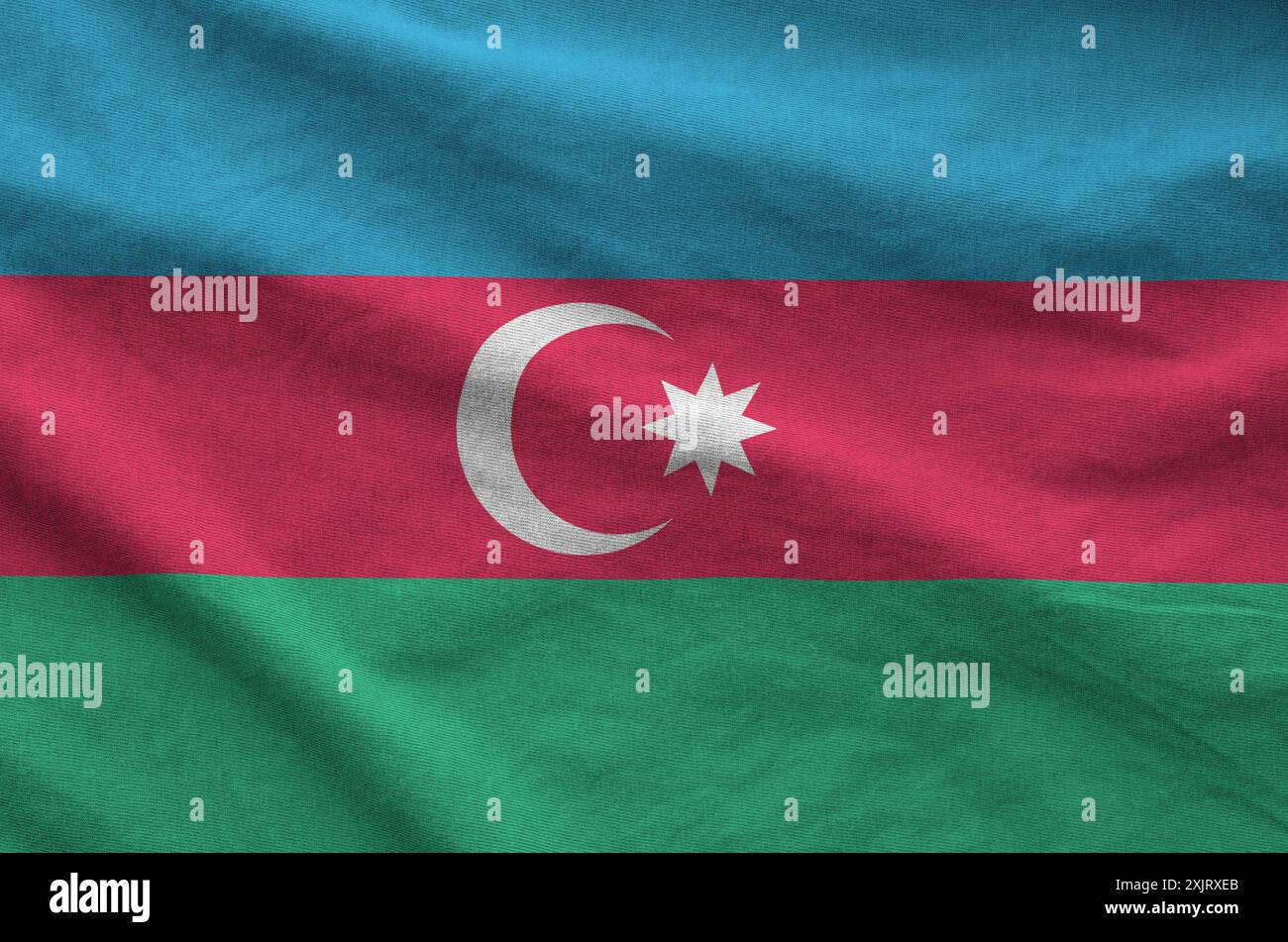 Azerbaijan flag depicted on folded wavy fabric of old cloth close up Stock Photo