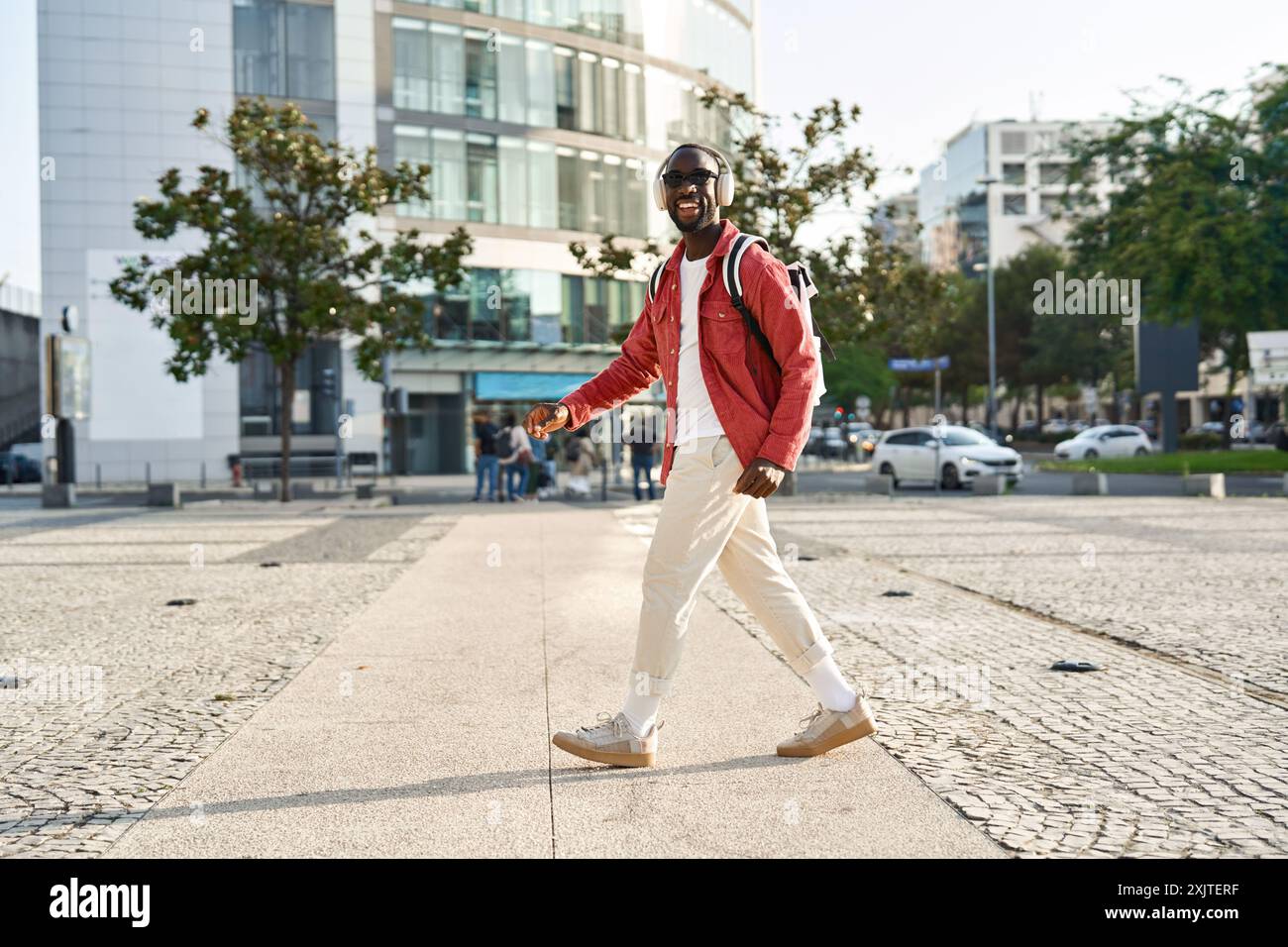 Black man walking on street hi-res stock photography and images - Alamy